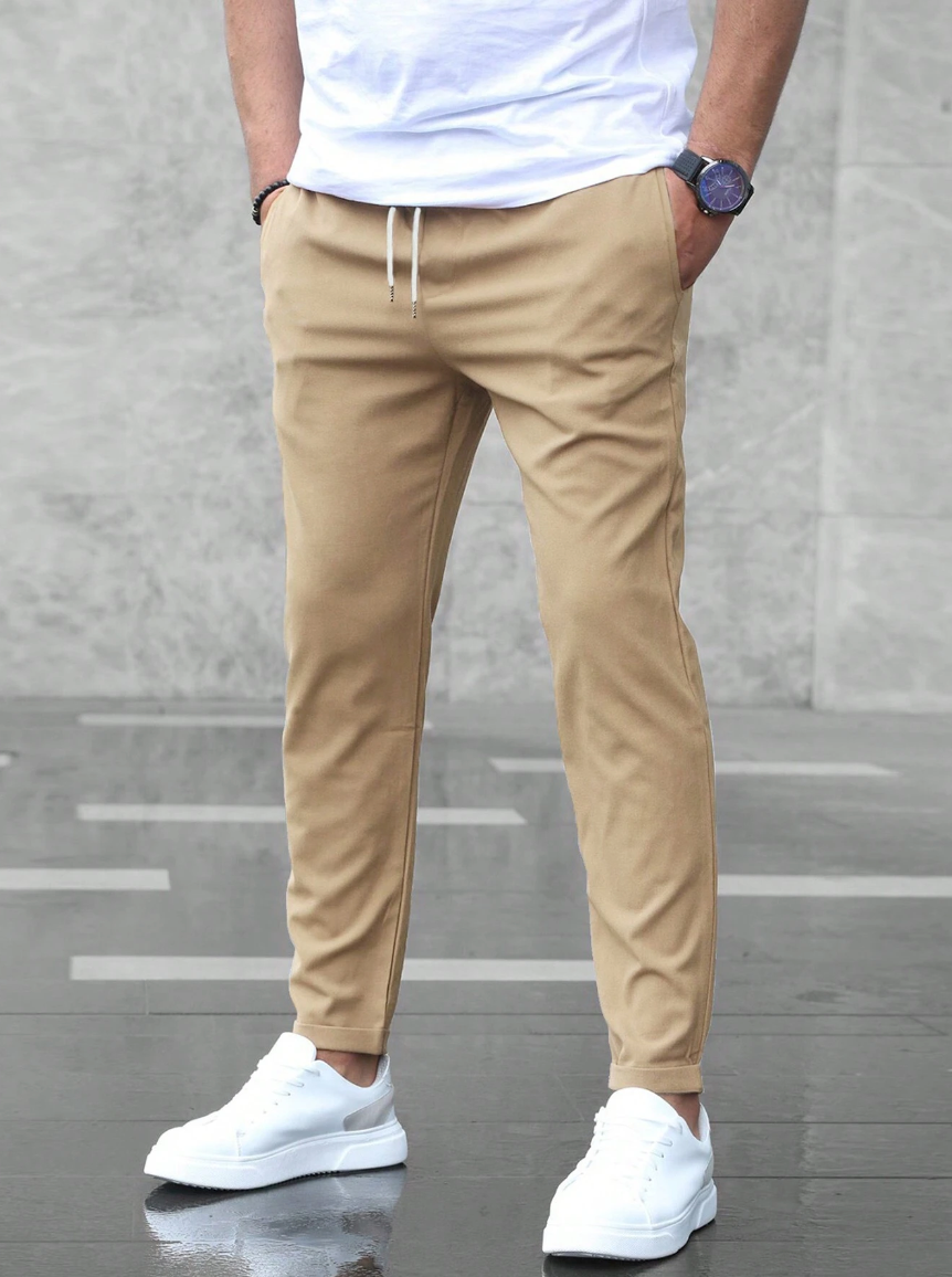 Men's slim fit jogger pants with drawstring waist and tapered cuff in grey
