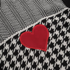Men's black knitted polo cardigan with houndstooth pattern and red heart patch