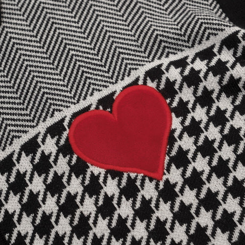Men's black knitted polo cardigan with houndstooth pattern and red heart patch