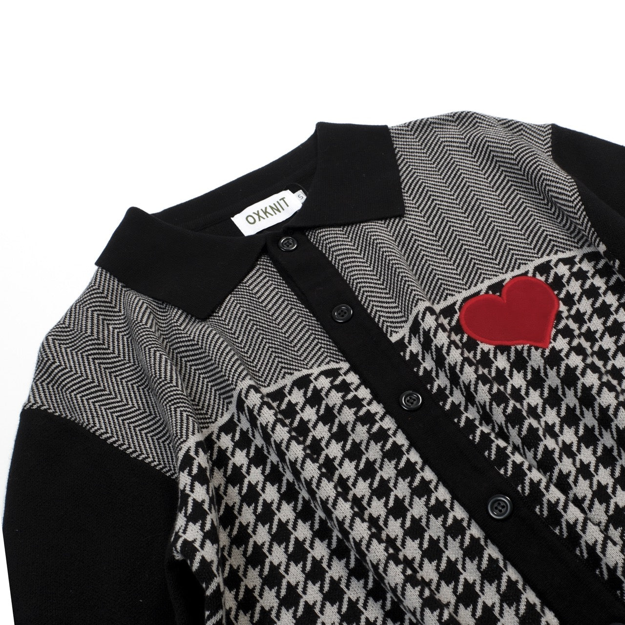 Men's black knitted polo cardigan with houndstooth pattern and red heart patch