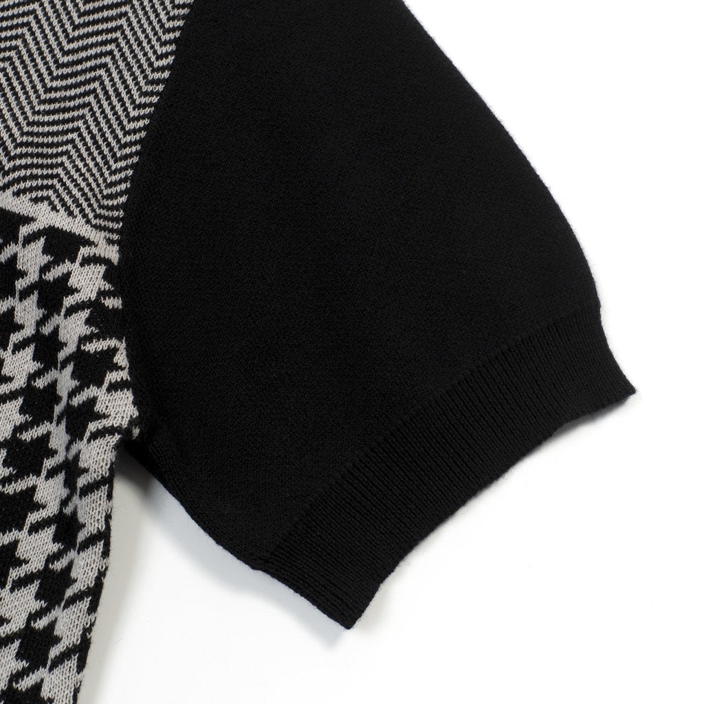 Men's black knitted polo cardigan with houndstooth pattern and red heart patch