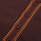 Men's dark brown knit polo shirt with yellow and red geometric trim