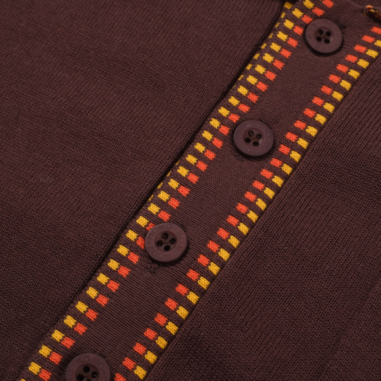 Men's dark brown knit polo shirt with yellow and red geometric trim