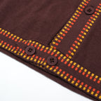 Men's dark brown knit polo shirt with yellow and red geometric trim