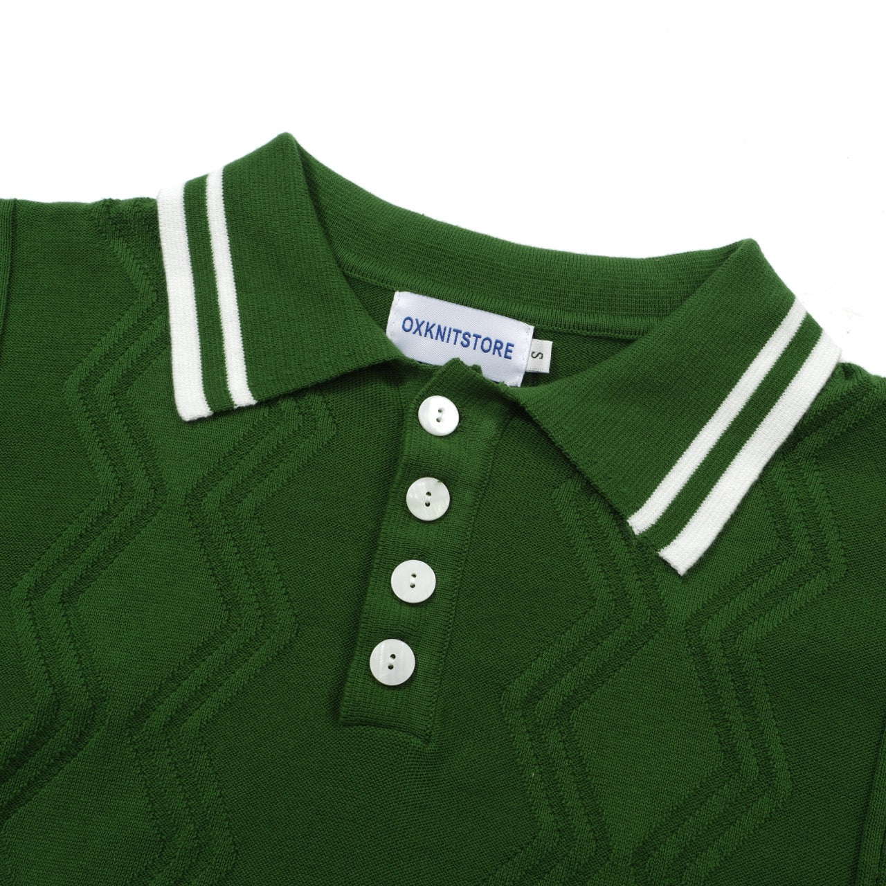 Men's green cable knit polo shirt with striped collar and short sleeves