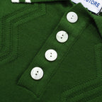 Men's green cable knit polo shirt with striped collar and short sleeves