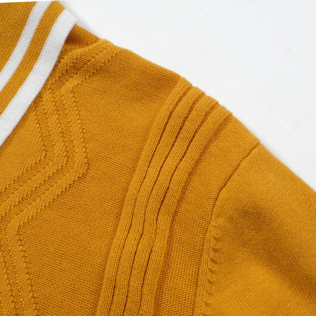 Yellow textured knit polo shirt with striped collar and short sleeves
