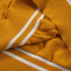 Yellow textured knit polo shirt with striped collar and short sleeves