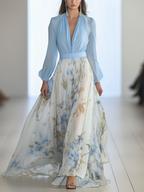 Women's floral maxi dress with blue long sleeves and flowing printed skirt