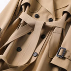 Women's long belted trench coat with double-breasted buttons, lapels and cuff straps