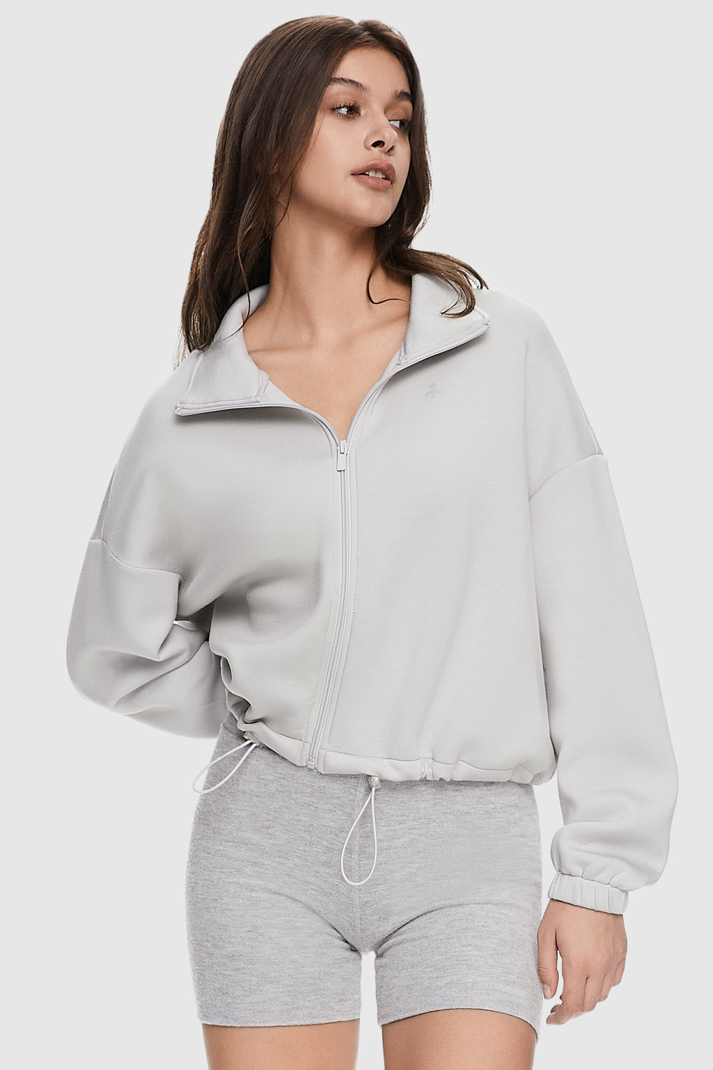 Women's cropped full zip sweatshirt with raised collar and drawstring hem