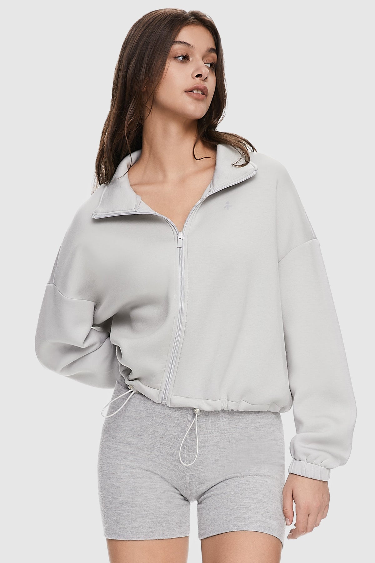 Women's cropped full zip sweatshirt with raised collar and drawstring hem