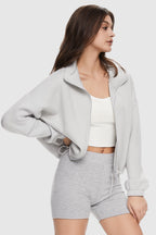 Women's cropped full zip sweatshirt with raised collar and drawstring hem