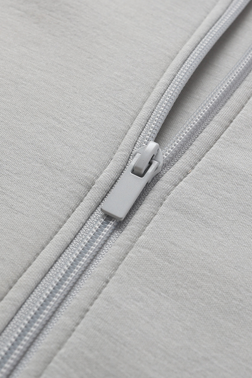Women's cropped full zip sweatshirt with raised collar and drawstring hem