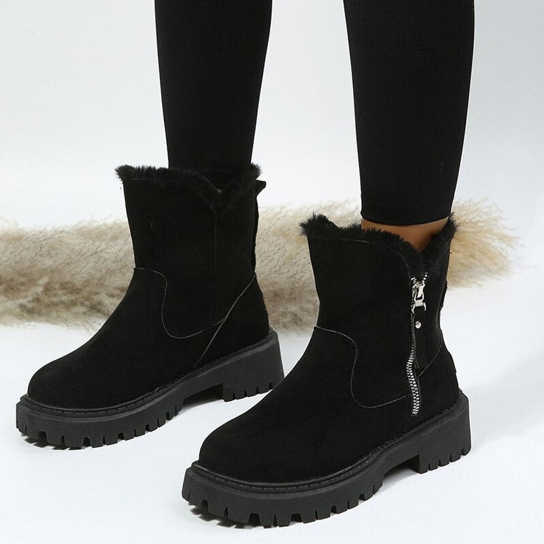 Women's ankle boots with faux fur trim, side zips and chunky lug soles