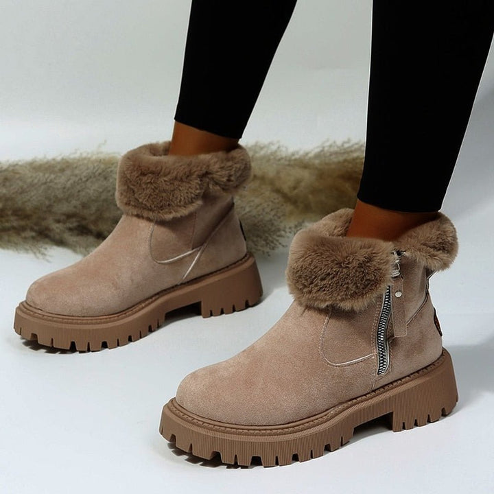 Women's ankle boots with faux fur trim, side zips and chunky lug soles
