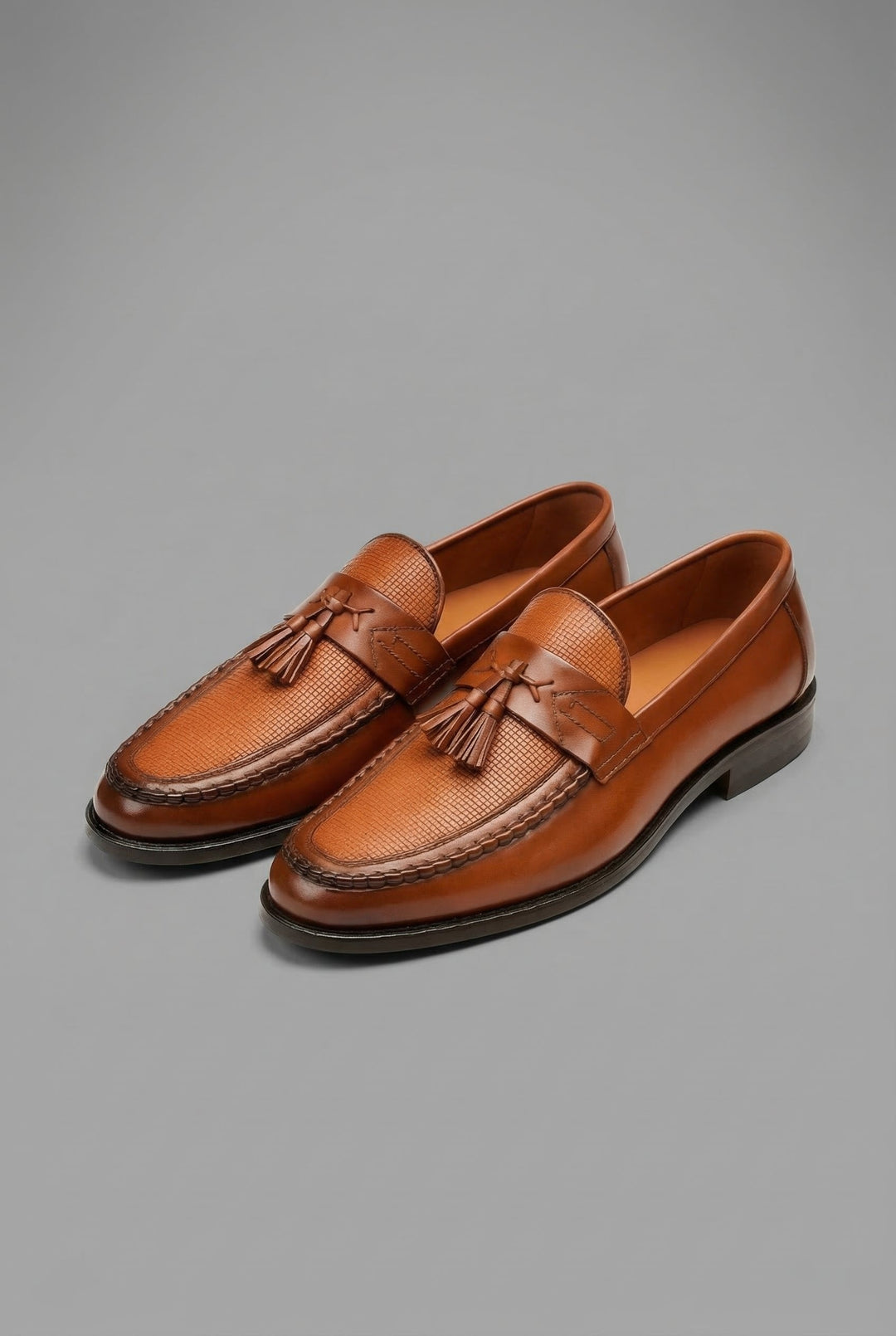 Men's woven tassel loafers with textured vamp and low heel