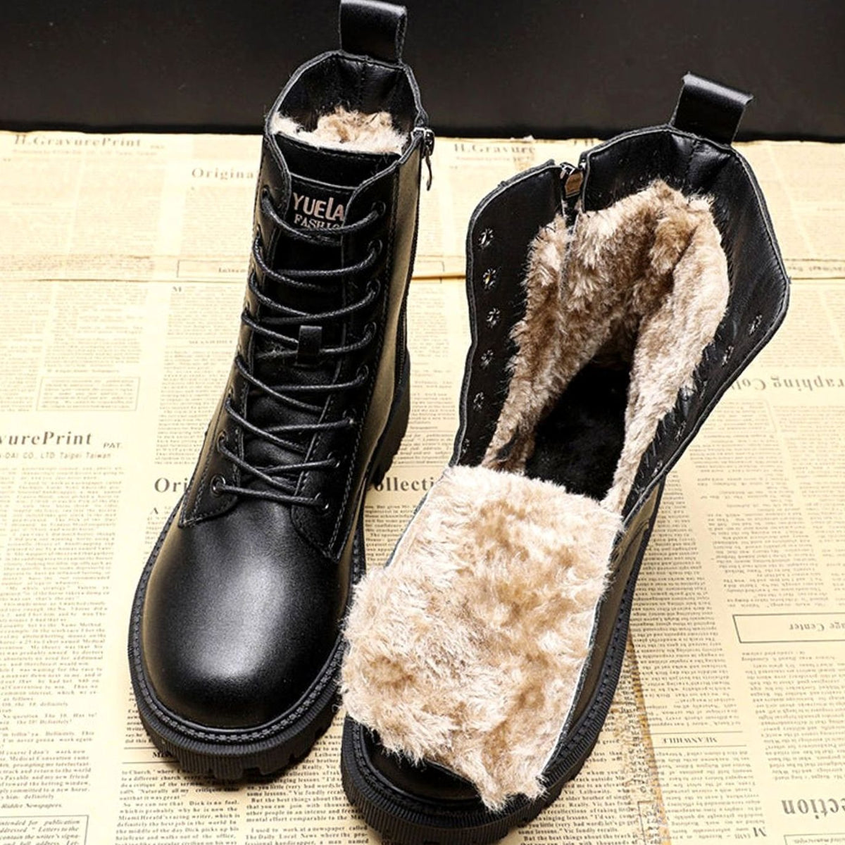 Black women's lace-up ankle boots with plush lining and ridged soles