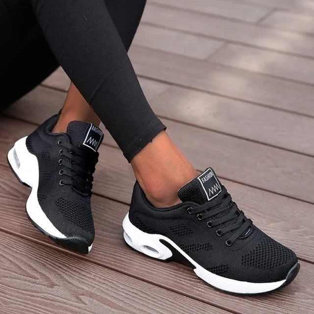 Low-top lace-up sneakers with perforated upper and segmented sole