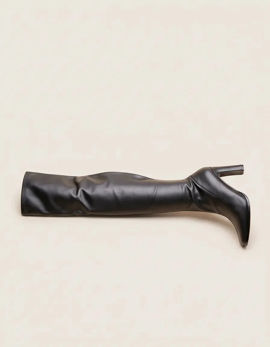 Women's black knee-high boots with pointed toes and block heels