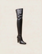 Women's black knee-high boots with pointed toes and block heels