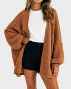 Women's oversized textured knit cardigan with open front and lantern sleeves