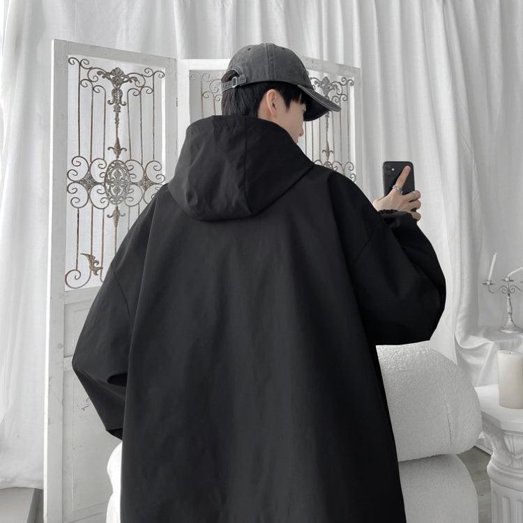 Women's oversized hooded windbreaker jacket with snap front and zip pockets