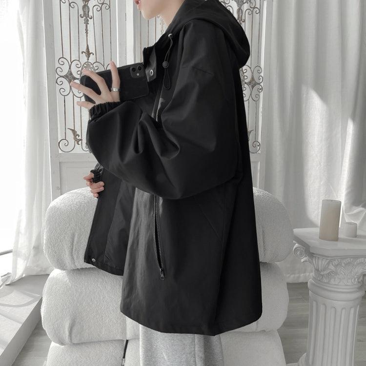 Women's oversized hooded windbreaker jacket with snap front and zip pockets