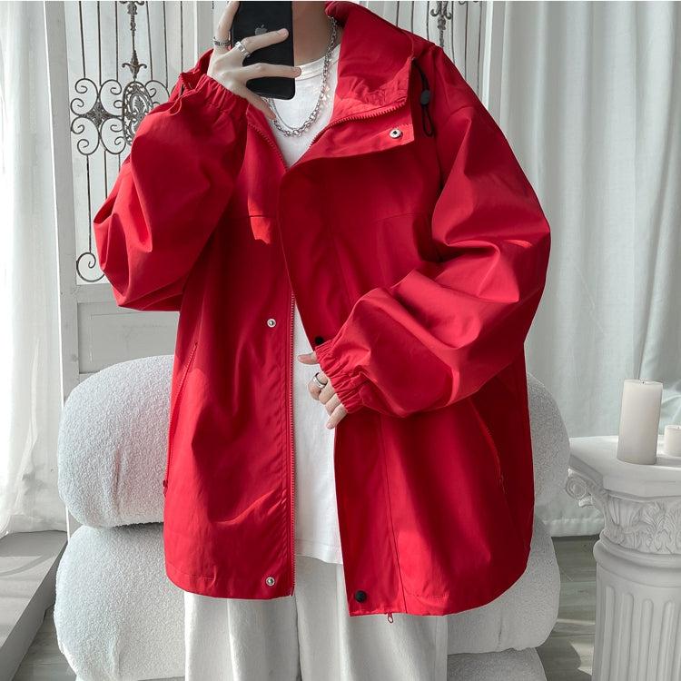 Women's oversized hooded windbreaker jacket with snap front and zip pockets