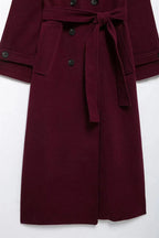 Women's burgundy double-breasted trench coat with belt and long sleeves