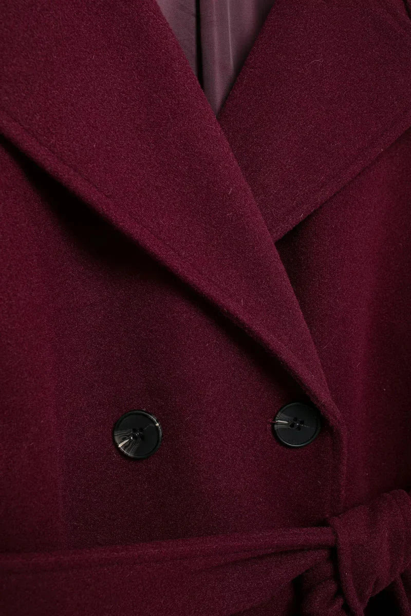Women's burgundy double-breasted trench coat with belt and long sleeves