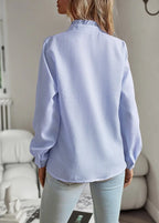 Women's long-sleeve blouse with ruffle neckline and front panel