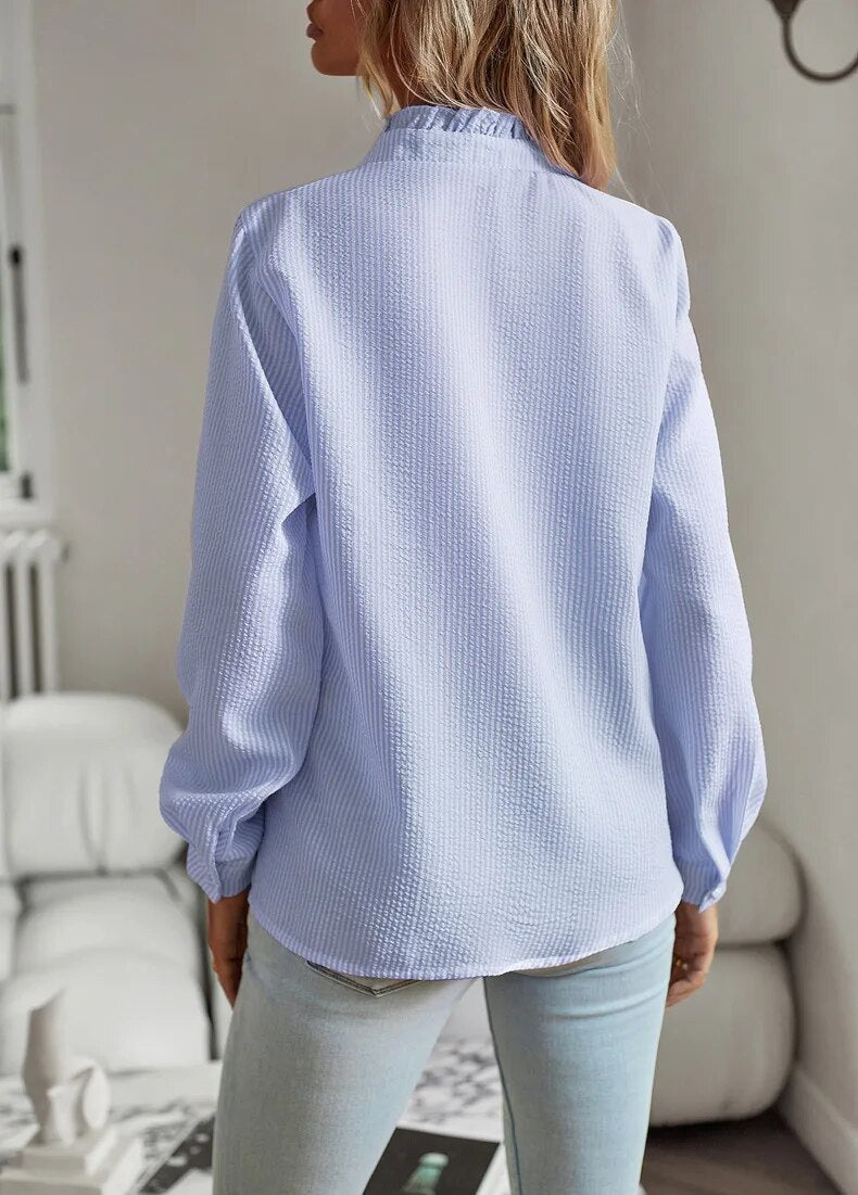 Women's long-sleeve blouse with ruffle neckline and front panel