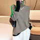 Women's geometric turtleneck sweater with contrasting sleeve stripes