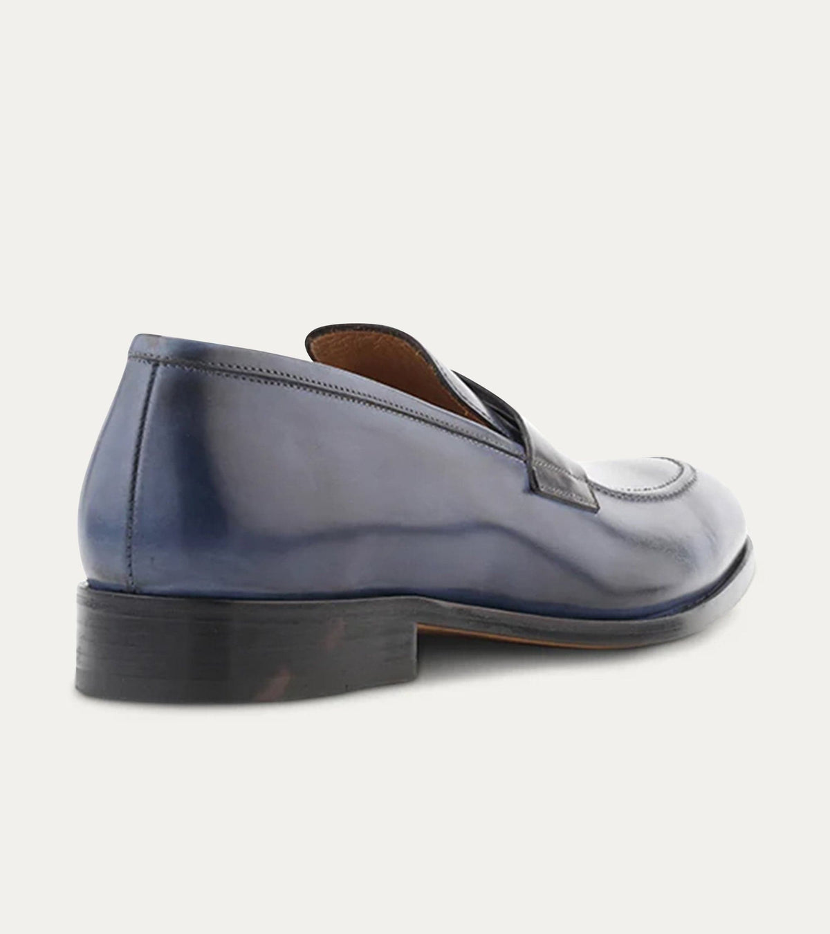 Blue penny loafers with square toes and low stacked heels
