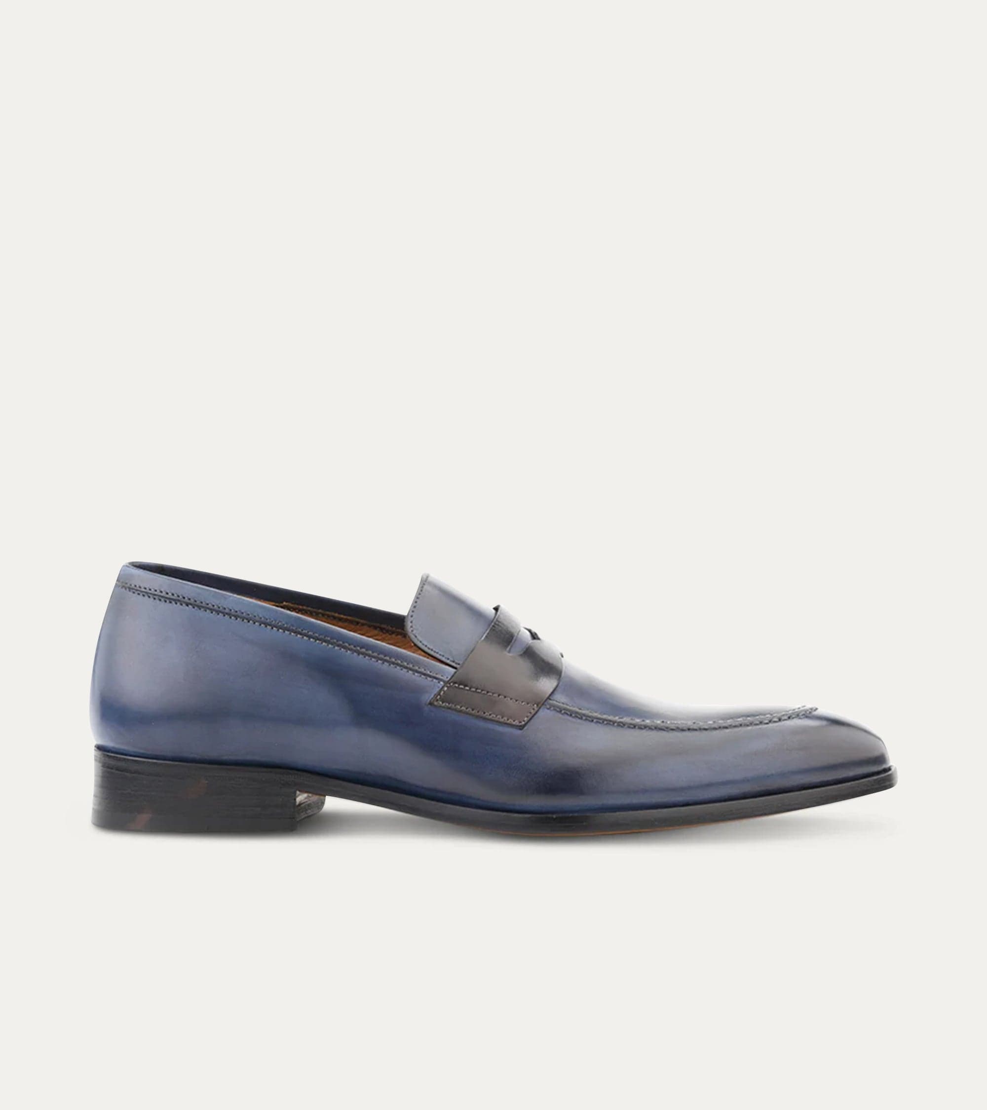 Blue penny loafers with square toes and low stacked heels