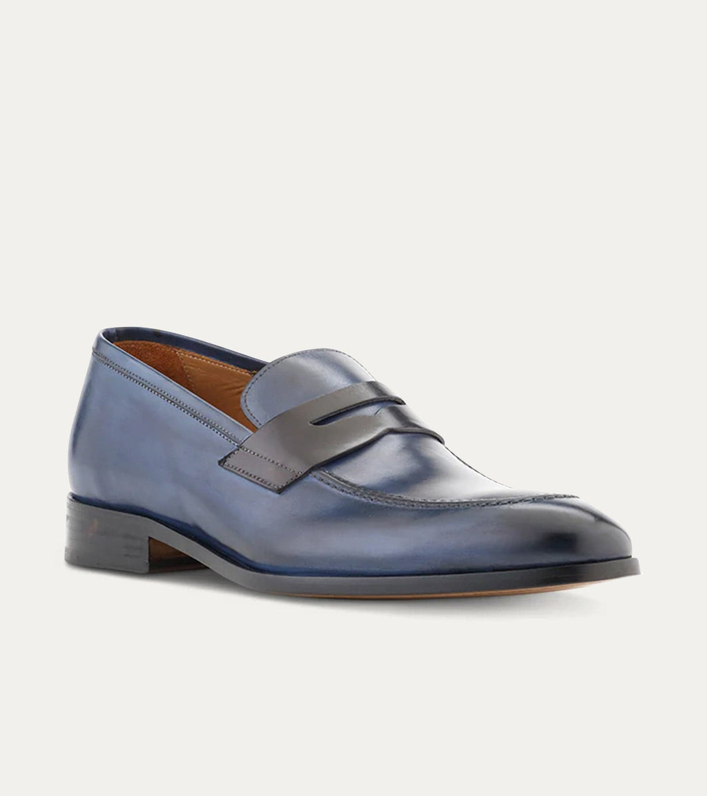 Blue penny loafers with square toes and low stacked heels