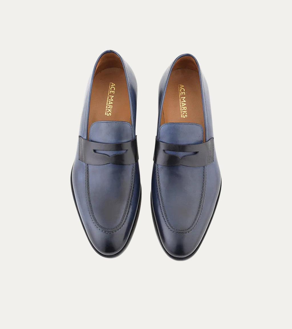 Blue penny loafers with square toes and low stacked heels