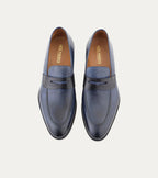 Blue penny loafers with square toes and low stacked heels