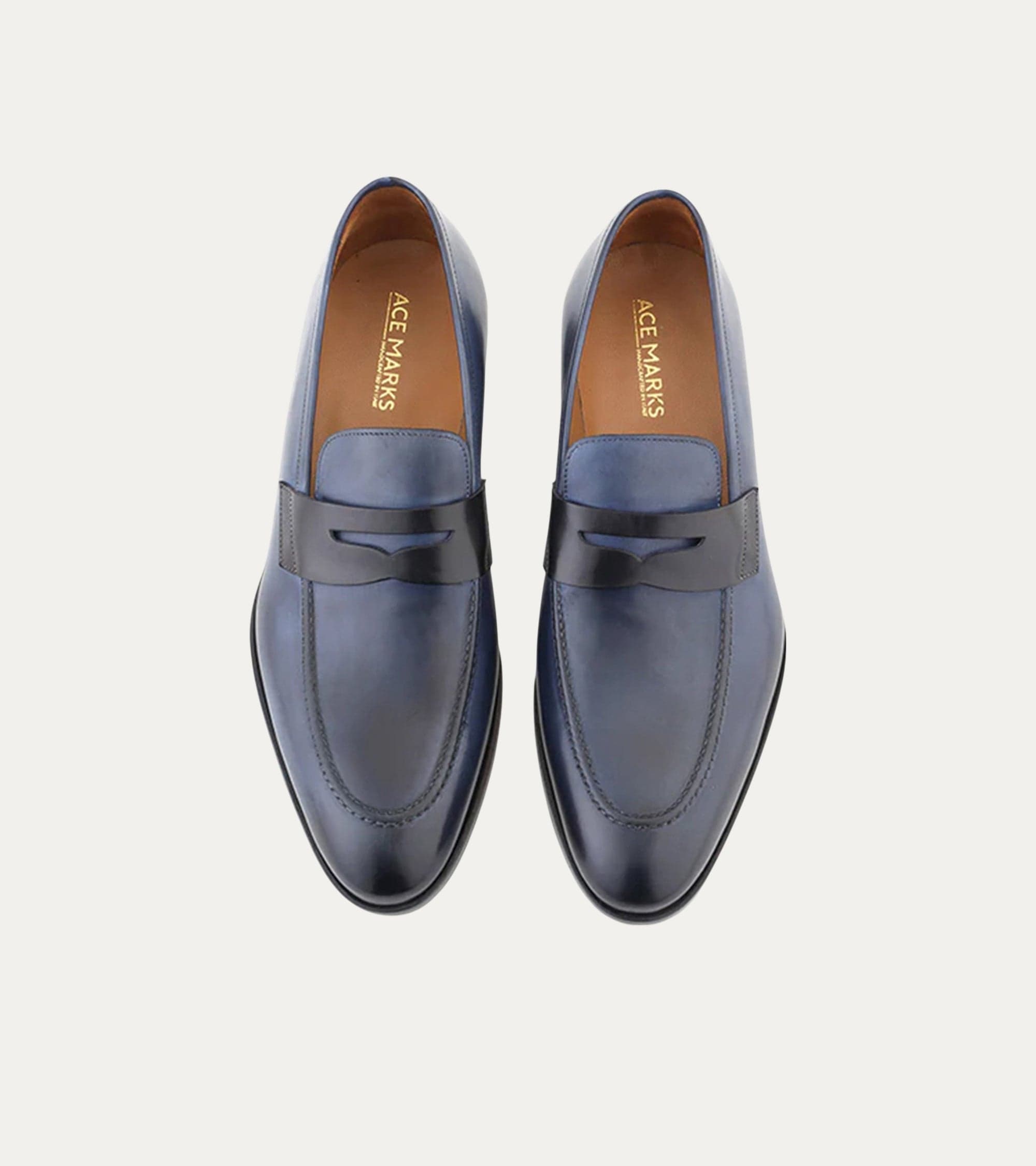 Blue penny loafers with square toes and low stacked heels