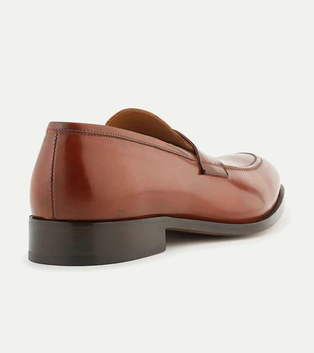 Men's brown polished penny loafer with almond toe and low heel