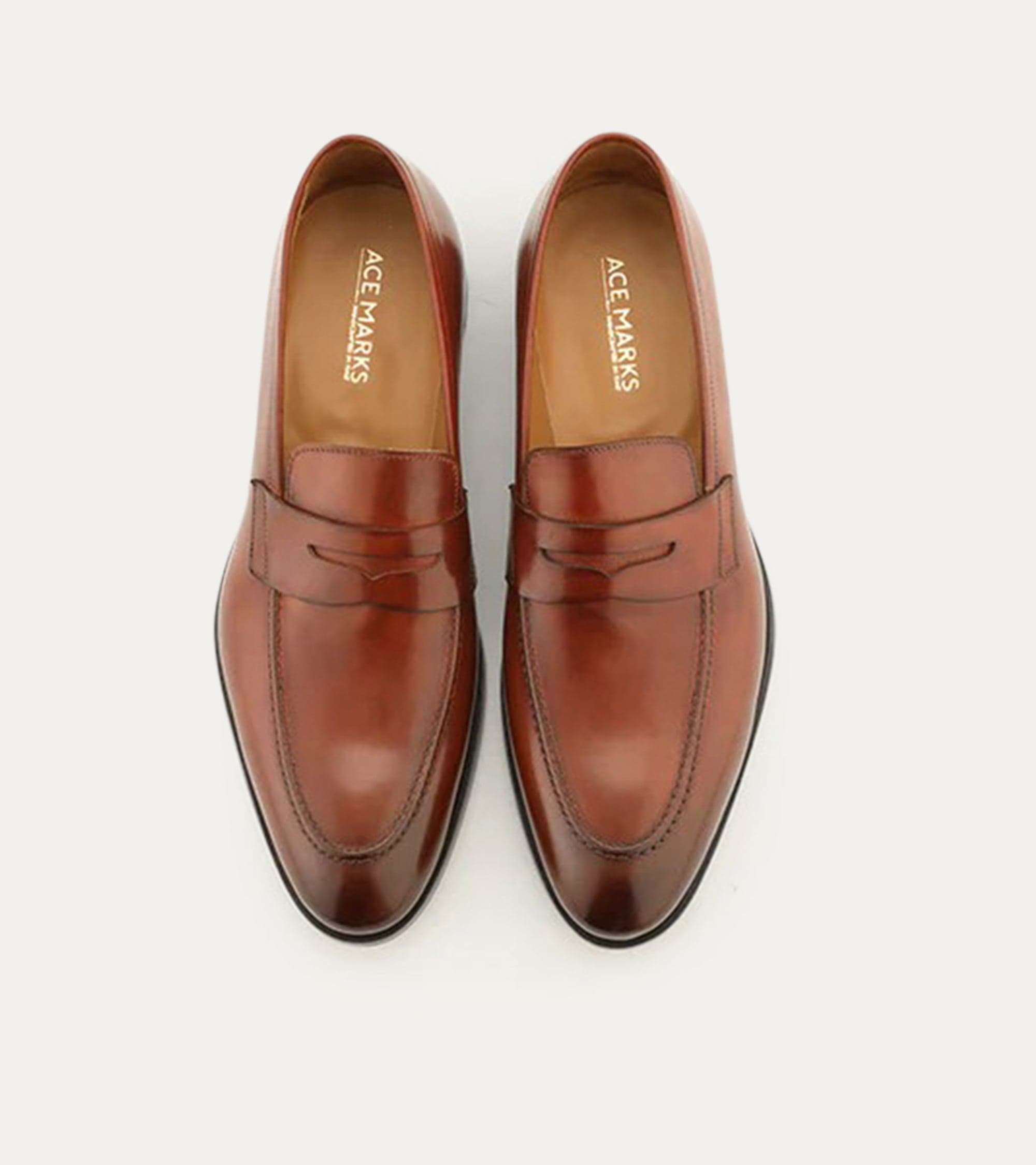 Men's brown polished penny loafer with almond toe and low heel