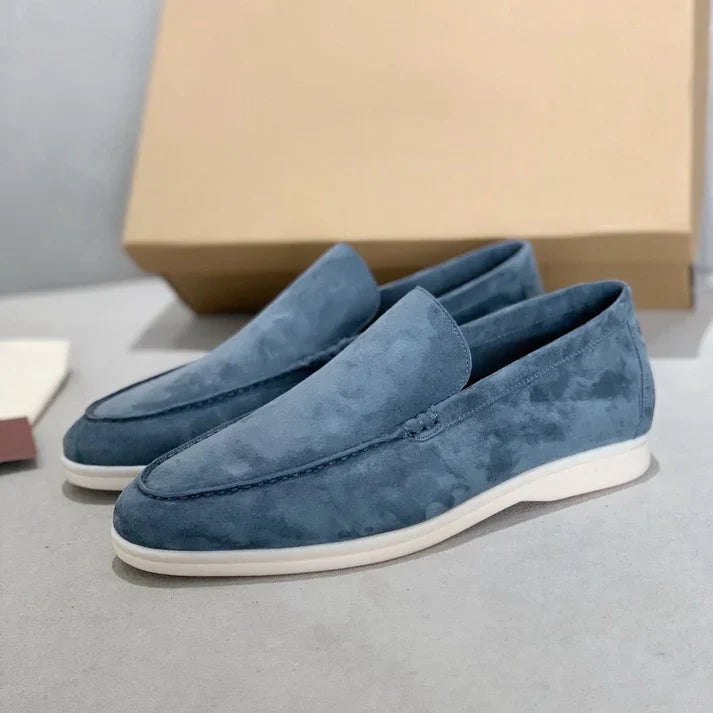 Men's slip-on loafers with textured uppers, moc toe stitching and white flat soles