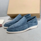 Men's slip-on loafers with textured uppers, moc toe stitching and white flat soles