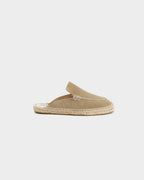 Beige unisex loafer mules with rounded toes, open heels and flat woven-effect soles
