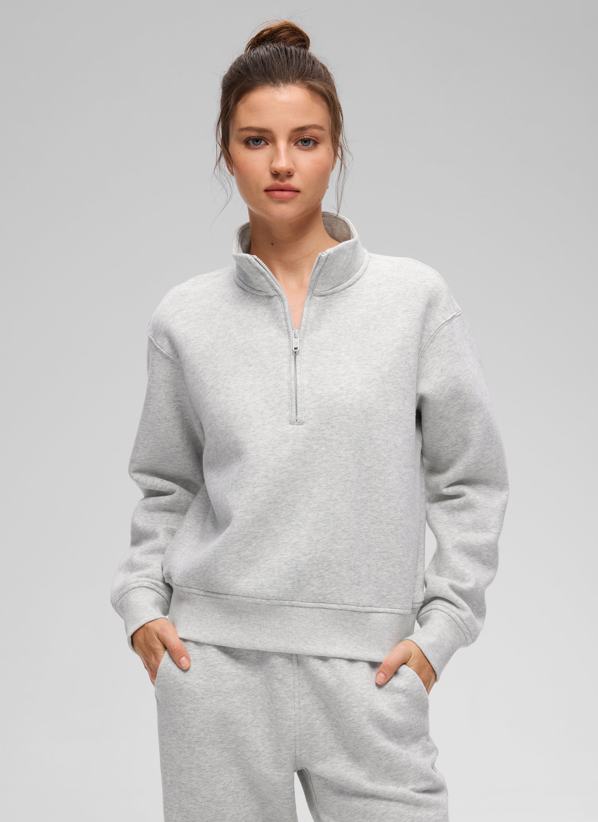 Women's funnel neck half-zip sweatshirt with long sleeves and ribbed trims