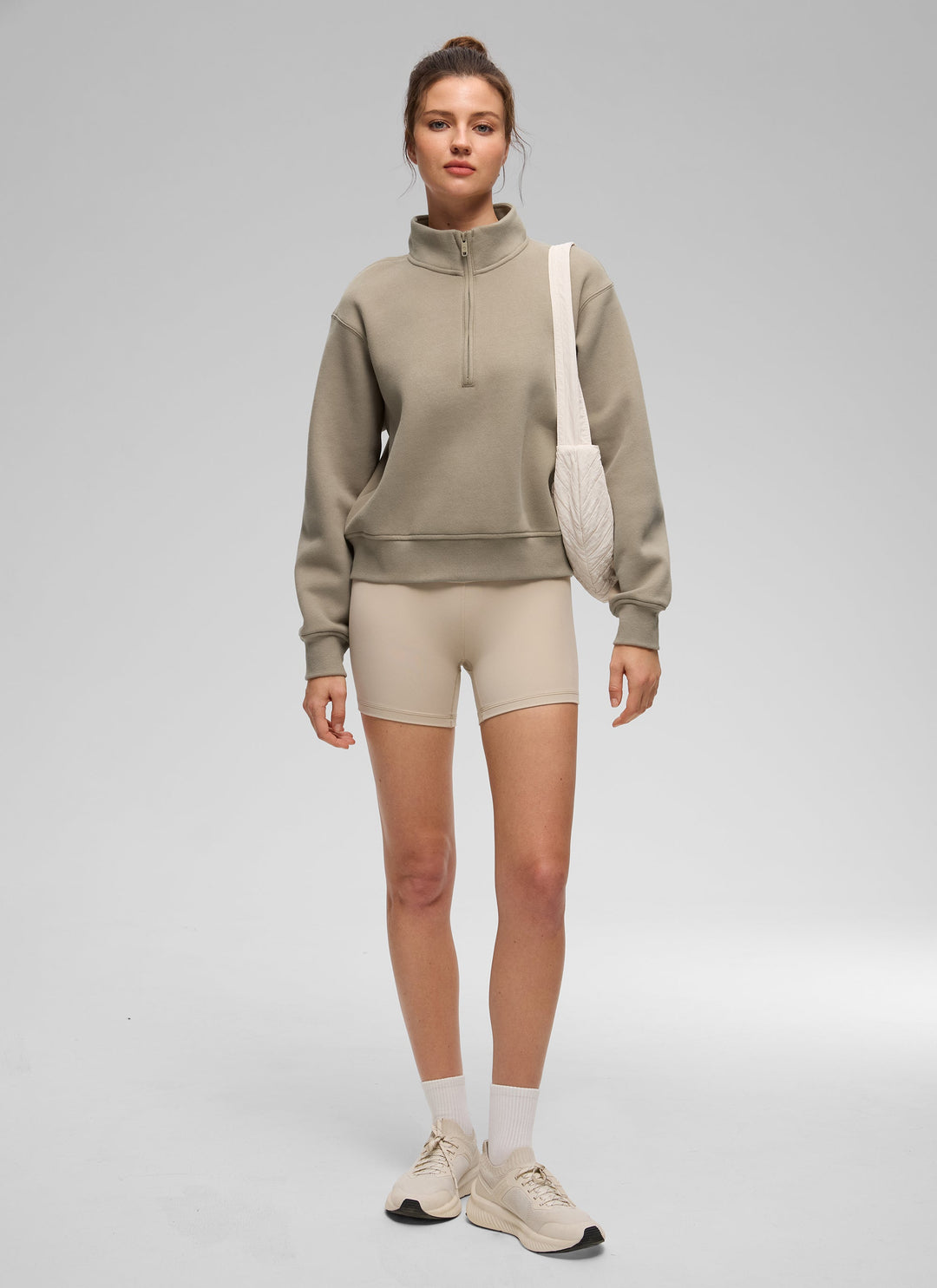 Women's funnel neck half-zip sweatshirt with long sleeves and ribbed trims