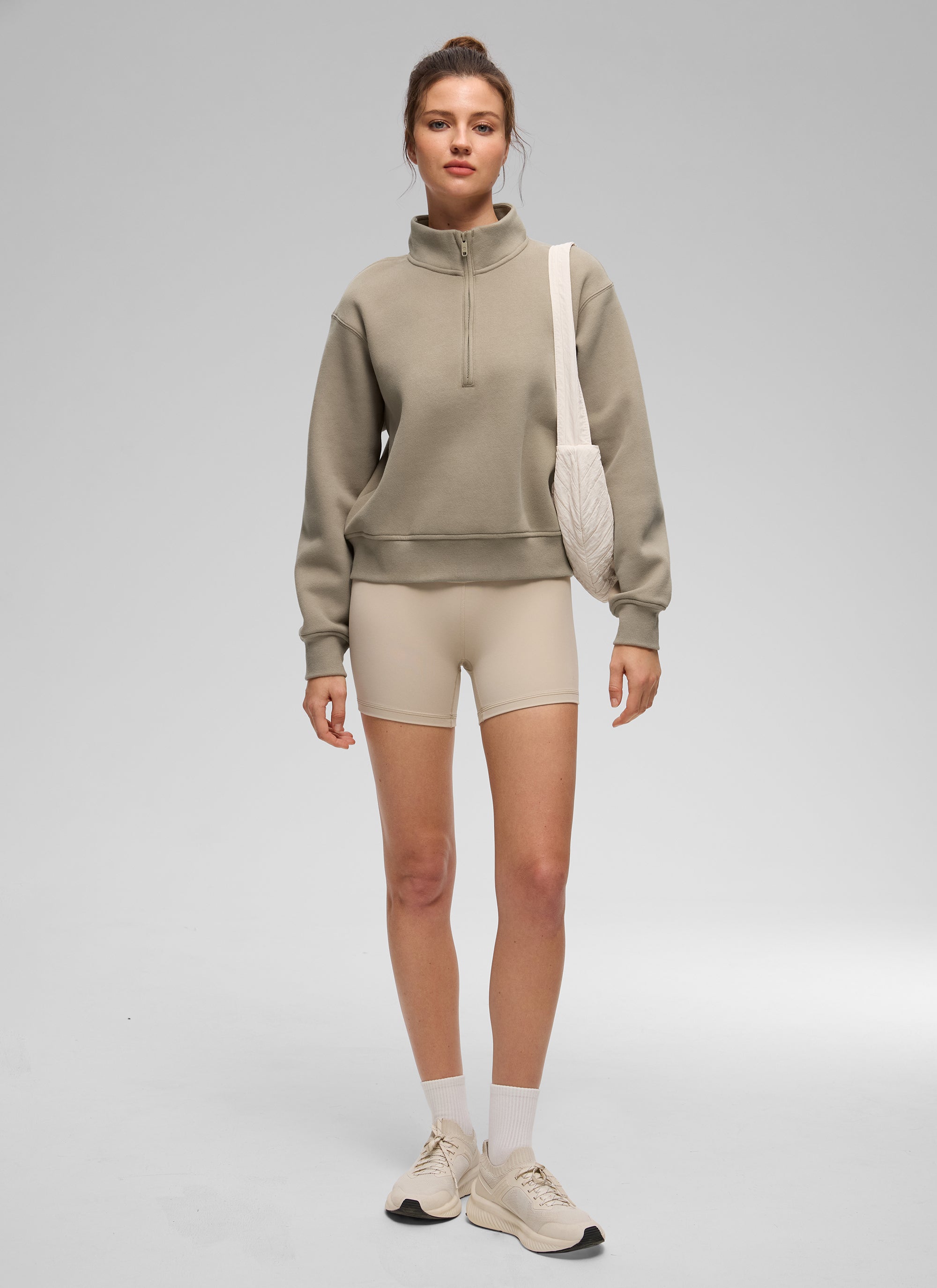 Women's funnel neck half-zip sweatshirt with long sleeves and ribbed trims