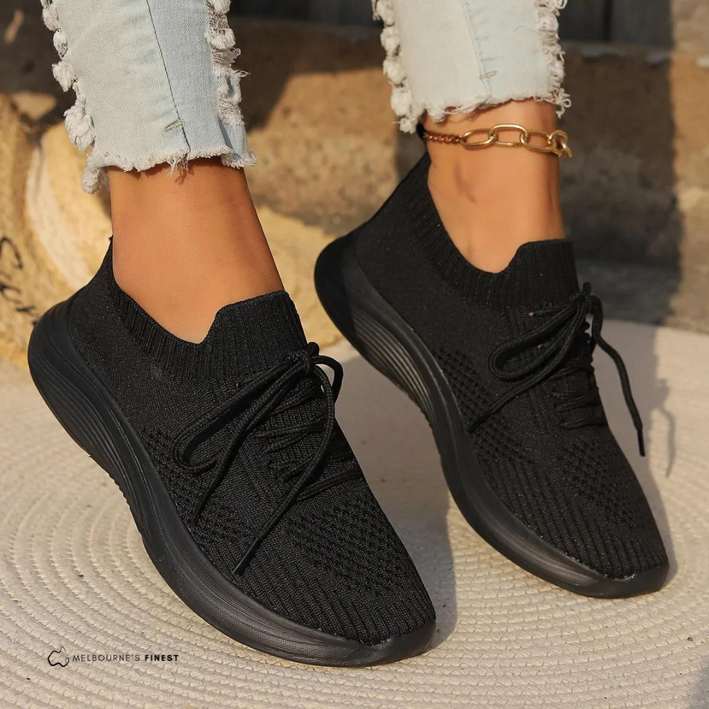 Women's knit lace-up sneakers with ribbed collars and raised textured soles