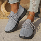 Women's knit lace-up sneakers with ribbed collars and raised textured soles